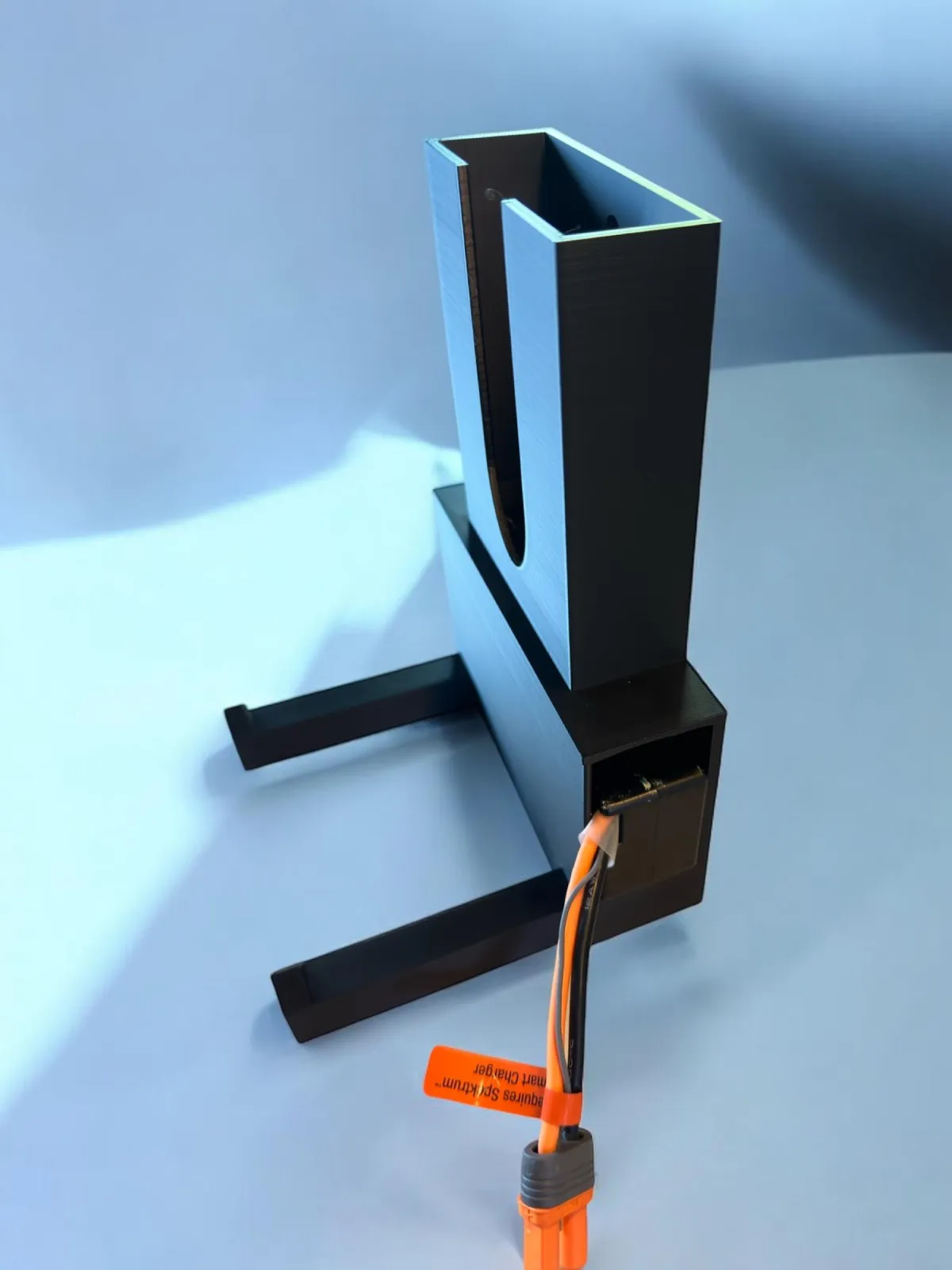 two young boys sitting at a desk with a book