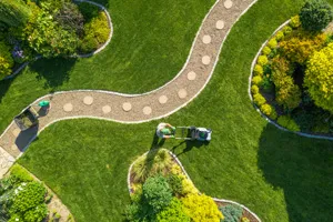 Aerial view of a landscaped garden with a curved stone path