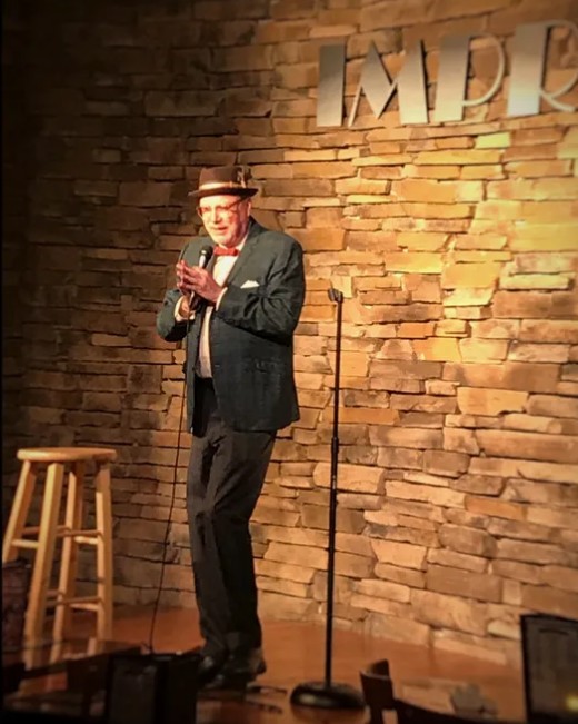 Rusty Z performing stand-up comedy and hypnosis on stage