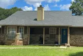 Full home view of roof replacement in Pelham Alabama with asphalt shingles by Blackline Roofing