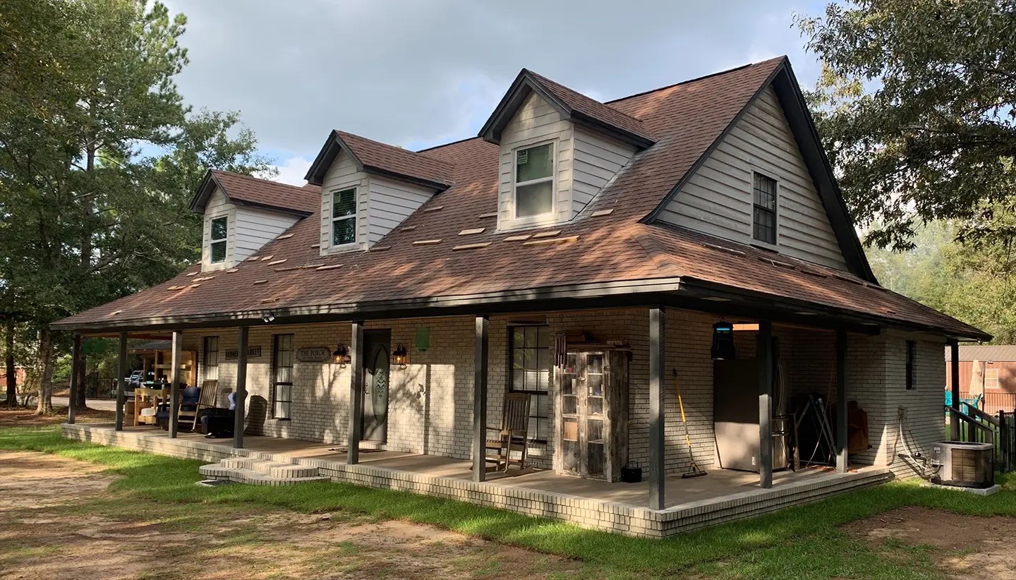 Before photo of aging roof in Montevallo Alabama showing worn asphalt shingles prior to replacement by Blackline Roofing