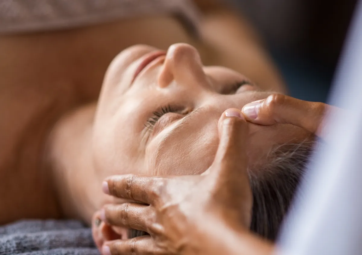 Woman receiving a facial massage