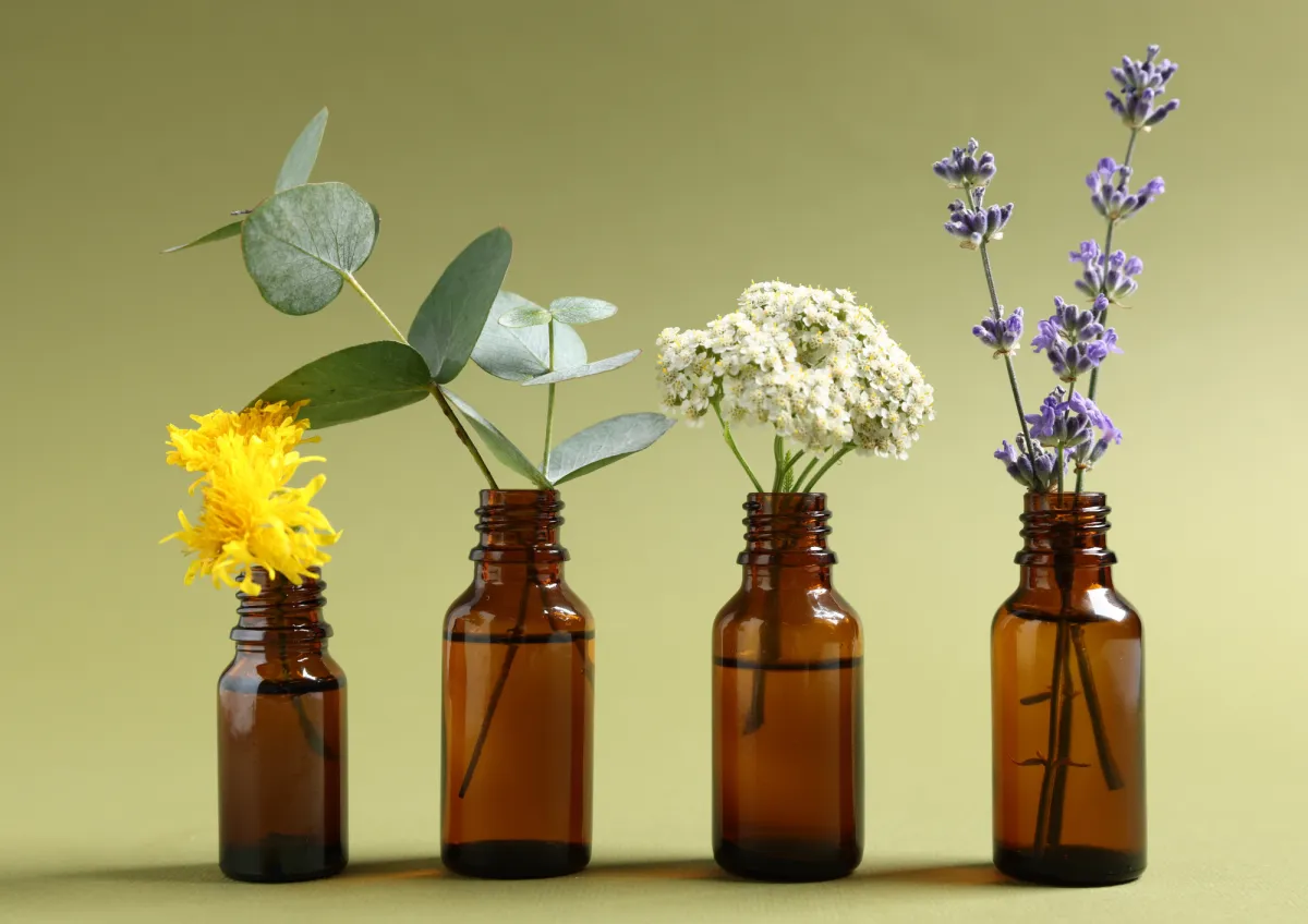 Essential Oil Bottles with their Associated Flowers