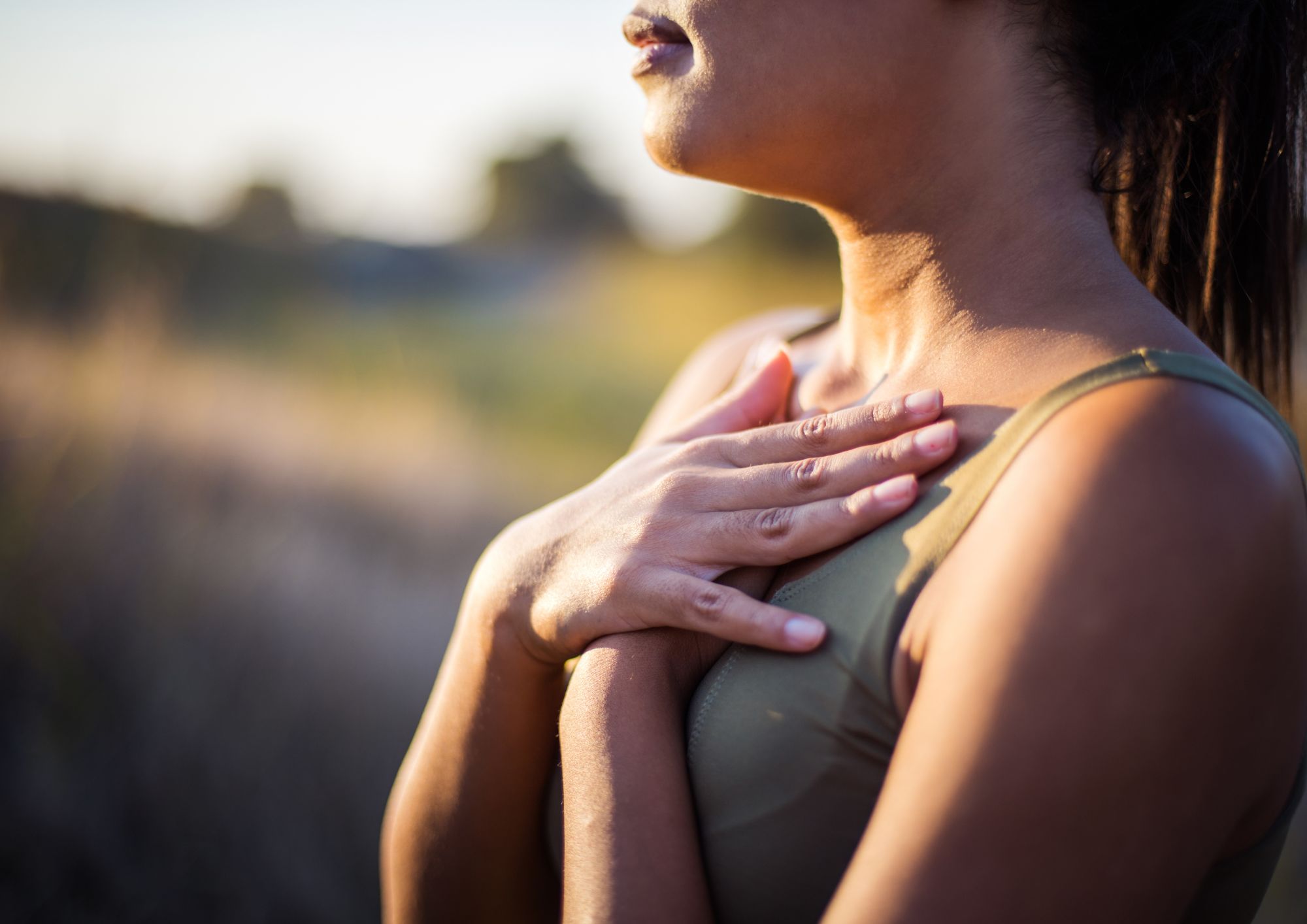 woman hands crossed over heart. ready to start self care at Pause, West Norfolk