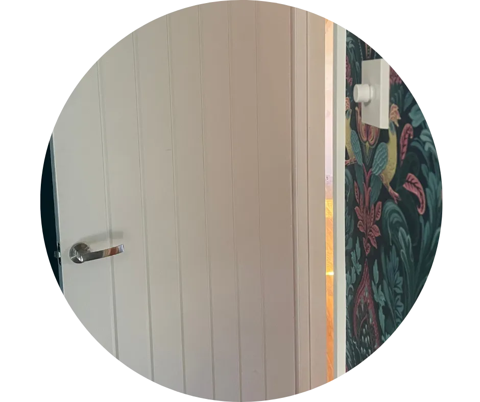 White internal panelled door with chrome handle and fitted door furniture, illustrating door hanging and finishing work by CDI Contractors.