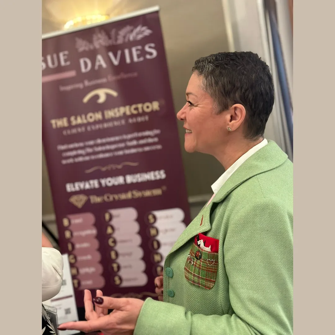 Sue Davies exhibiting at Salon Life talking with salon owners about online visibility