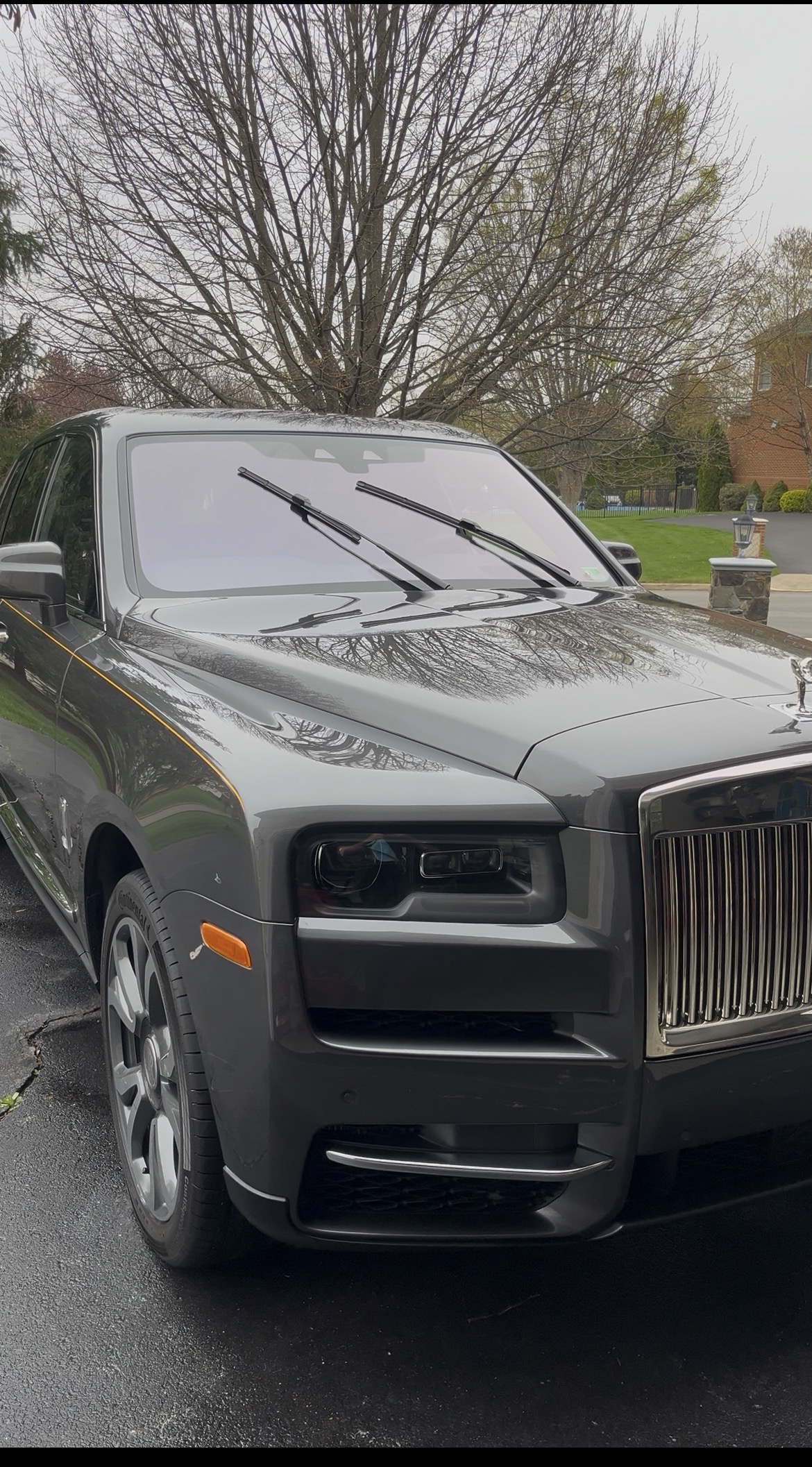 a person washing a car with a sponge
