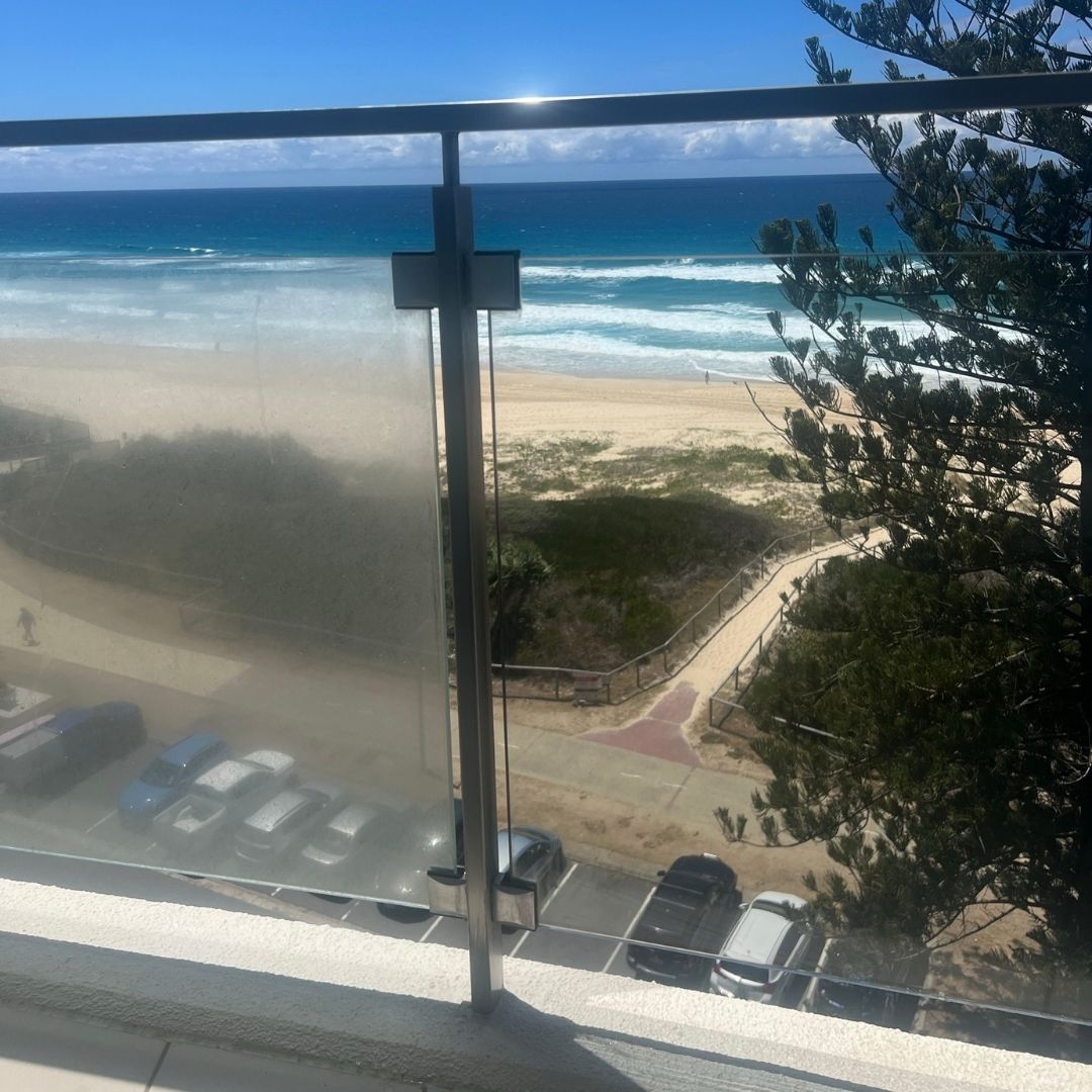 Transparent glass balustrade on balcony with clear views through clean glass