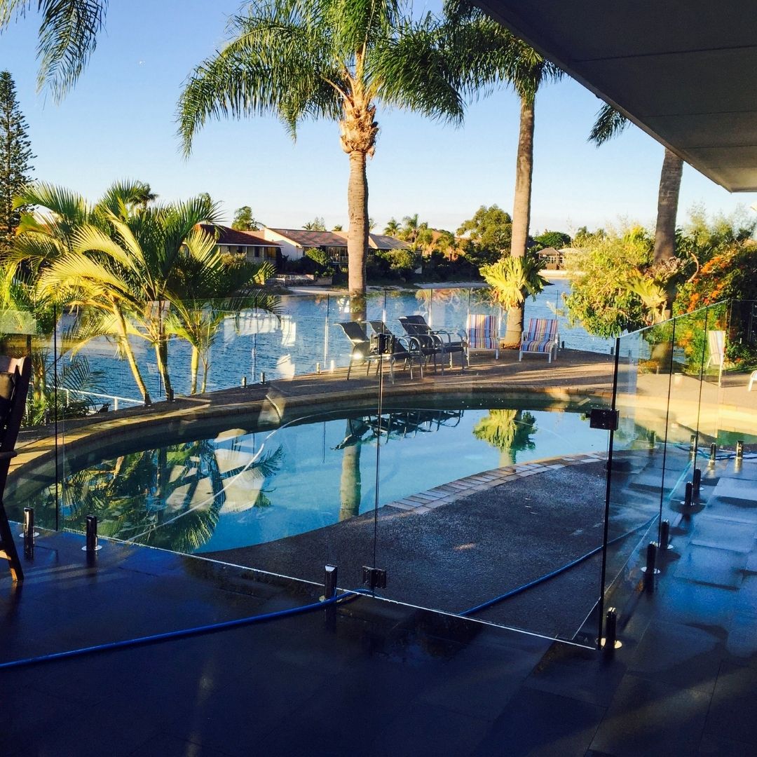 Spotless glass pool fence with clear view of swimming pool Gold Coast home