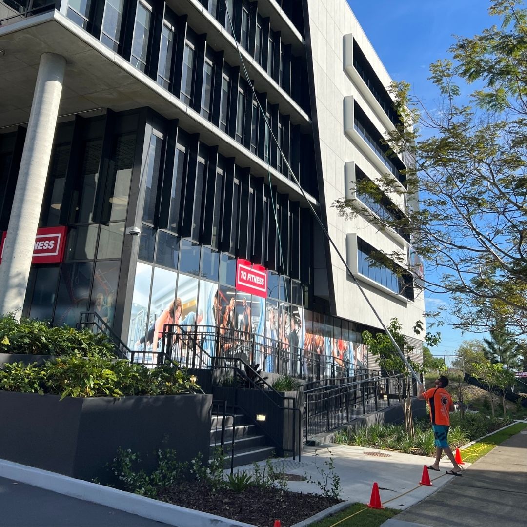 Exterior windows being cleaned on Gold Coast property sparkling results