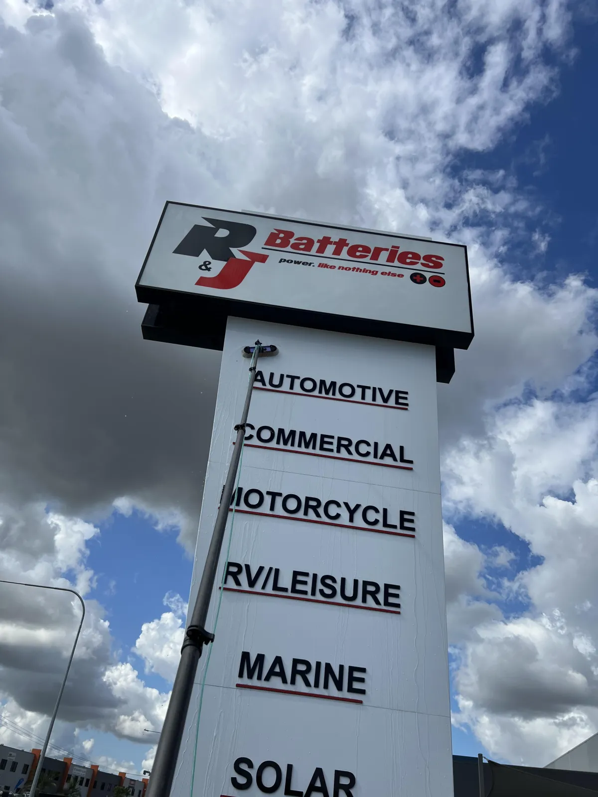 Professional signage cleaning on the Gold Coast by Zen Window Cleaning using extended reach systems.