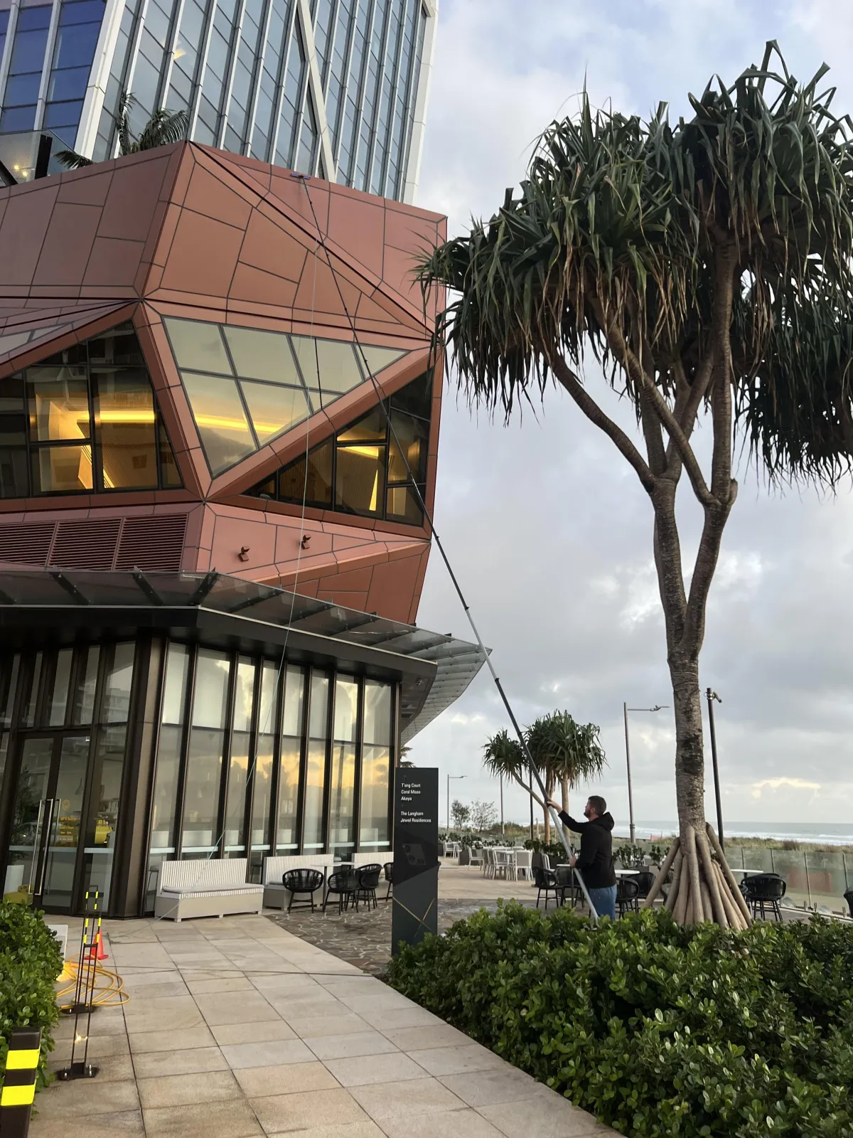 Commercial window cleaning on a The Langham Building in Broadbeach, Gold Coast