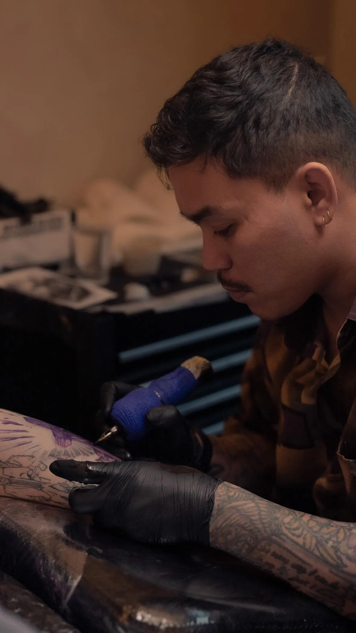 person in blue denim shorts and white nike sneakers standing on gray concrete floor