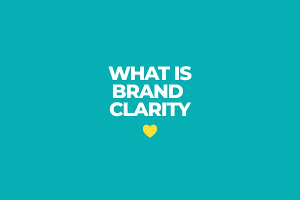 Teal background graphic with white headline text that reads What Is Brand Clarity? for a With Heart Marketing blog article about clarity, alignment, communication, and intentional growth.