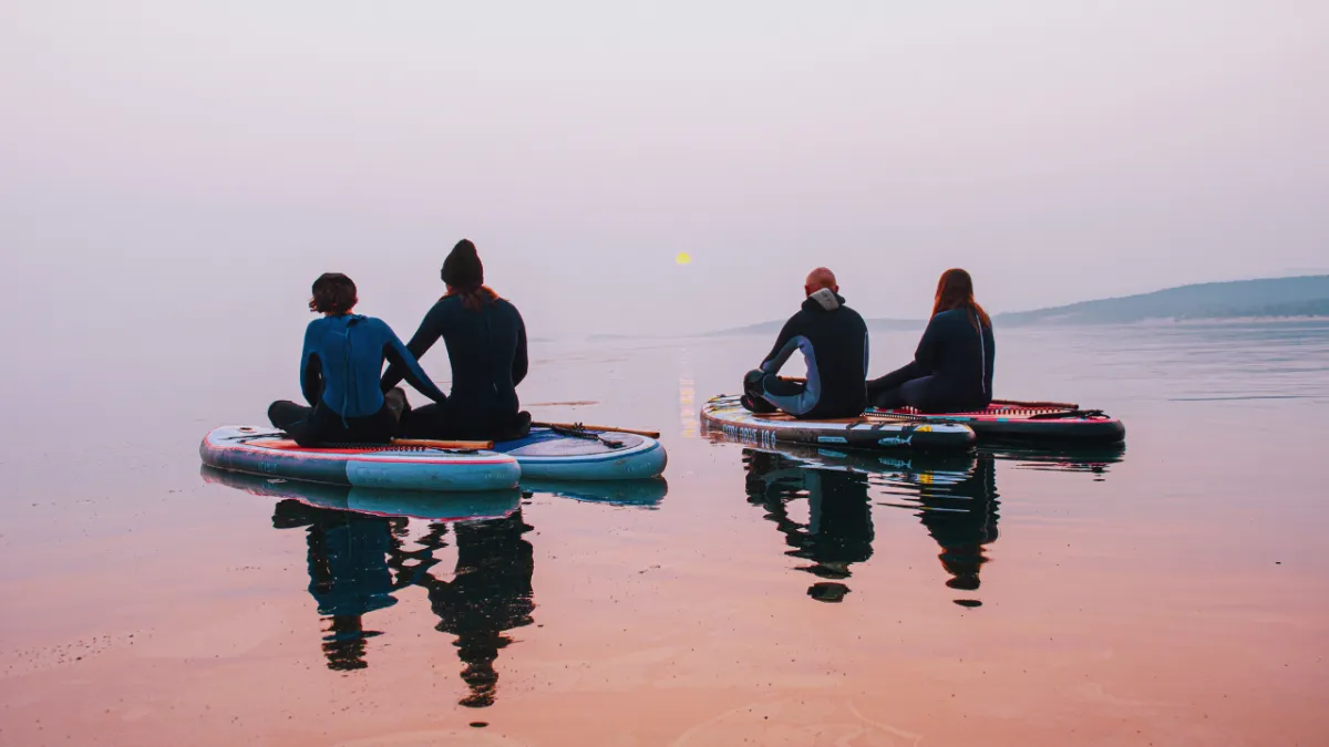 a group of people standing inside of a building