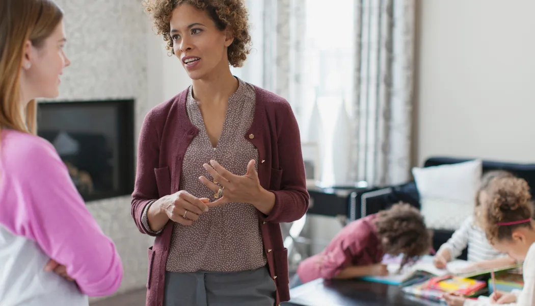 woman sitting on chair near white table