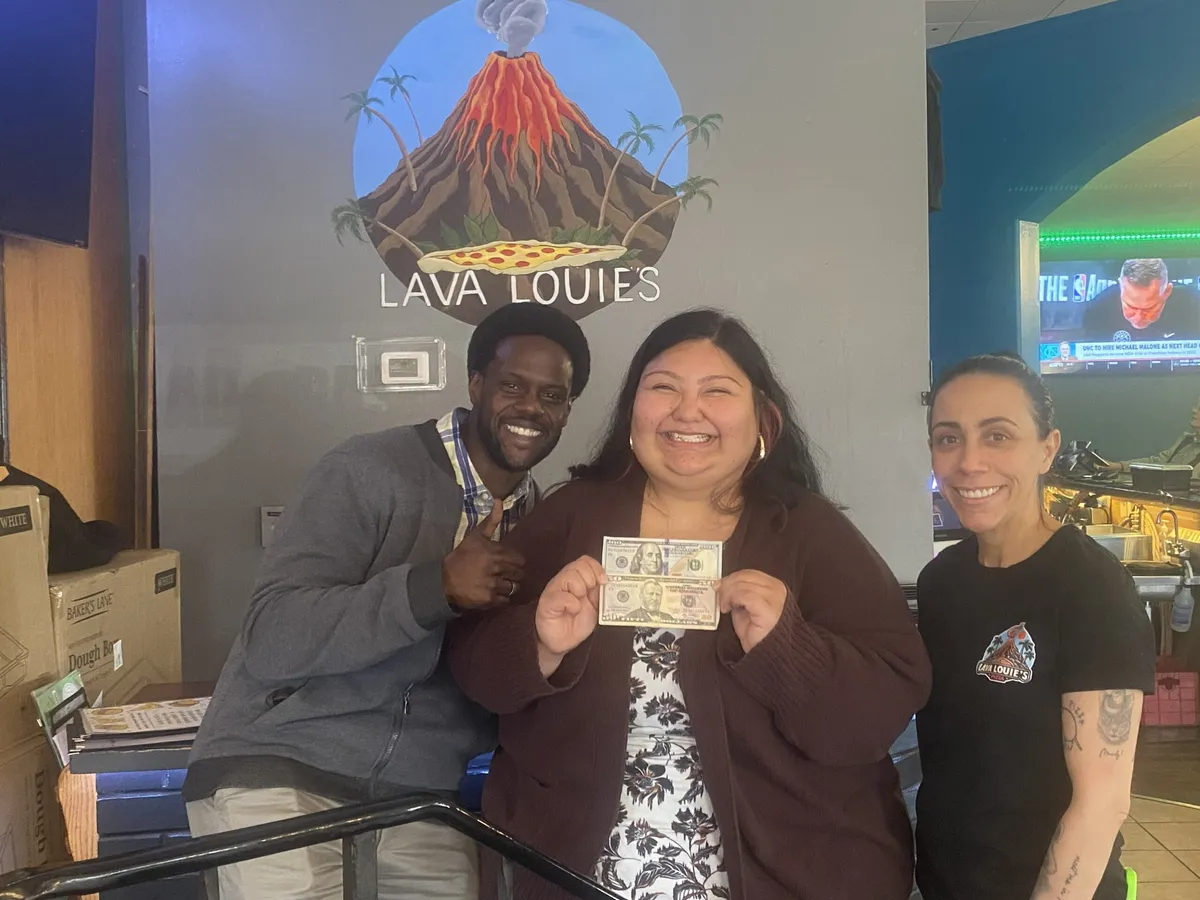 YAHREQA! winner Arrbreezy holding her cash prize at Lava Louie's in Oak Harbor