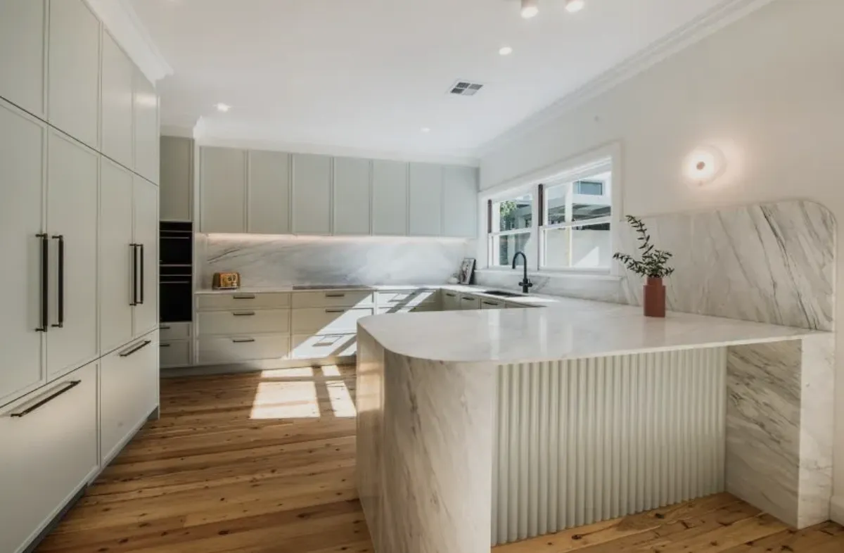 a kitchen with black cabinets