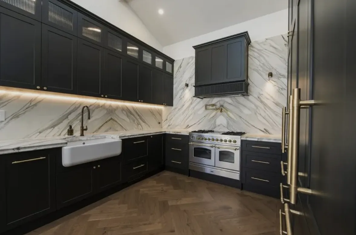 a kitchen with a bar stools