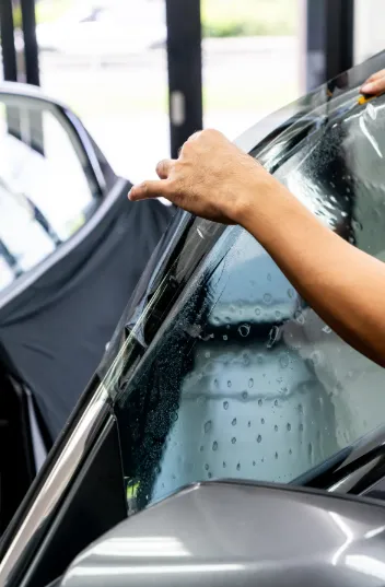 BrightHearth technician consulting with a homeowner beside a ladder and FestivaPro sample kit