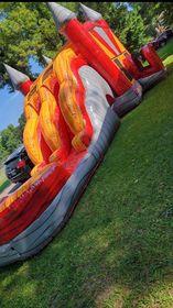 red and yellow Combo Bouncy House with slide