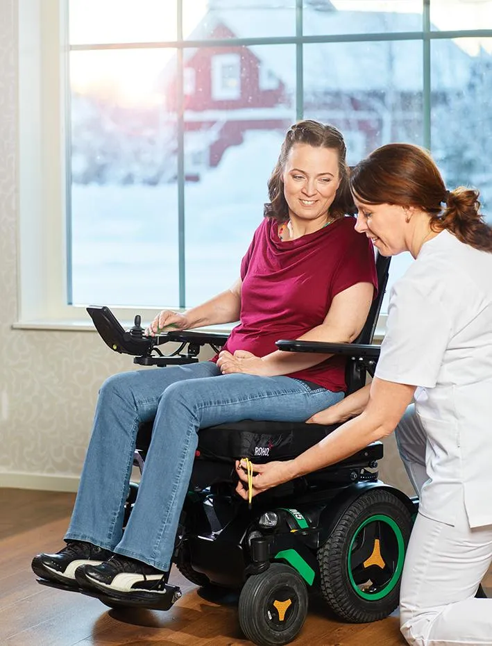 therapist fitting custom wheelchair