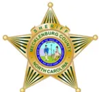 The logo for the Sherrifs of Mecklenburg County in North Carolina. A gold star sherrif's badge.