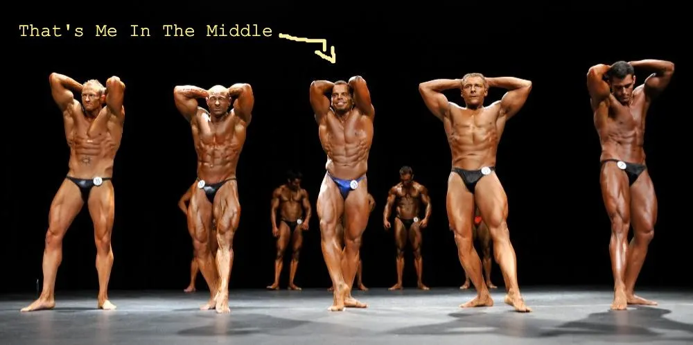 Lee Hayward competing on stage in bodybuilding