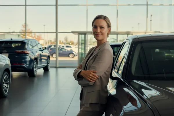 Automotive leader in dealership showroom