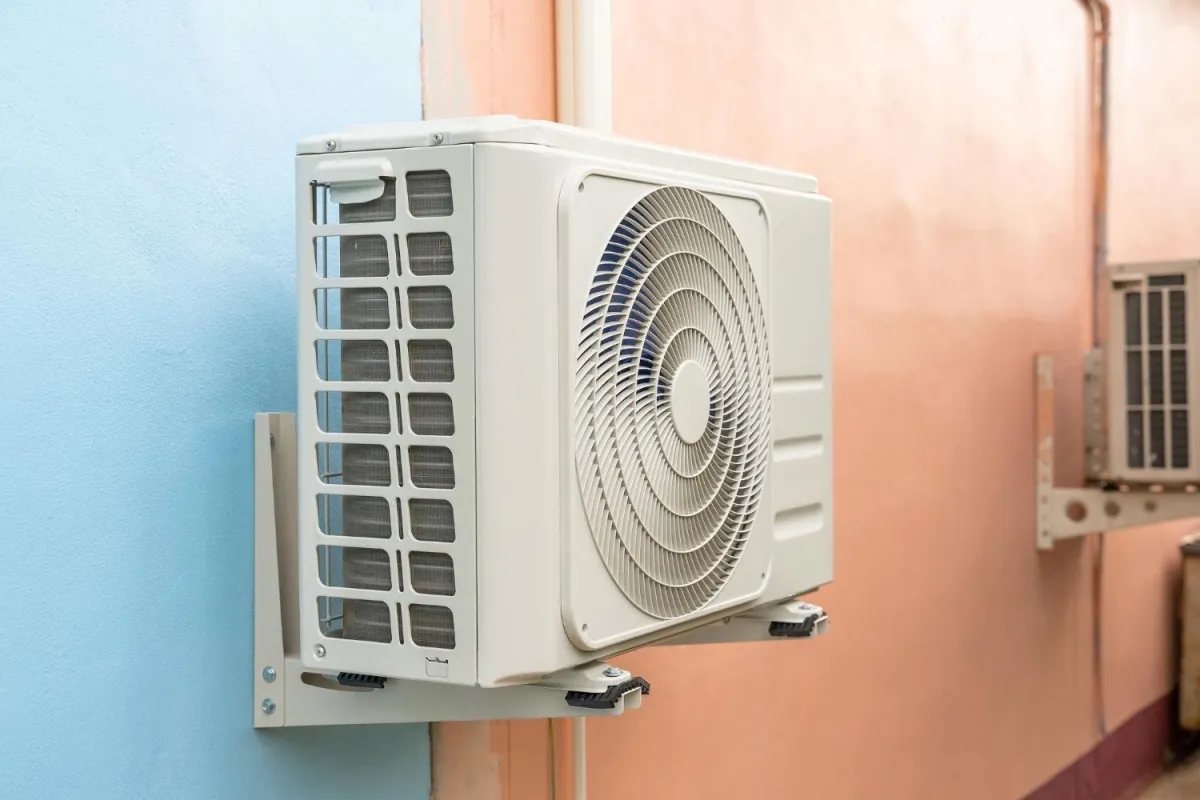 Wall-mounted air conditioner installed in a room, providing cooling and comfort for the indoor environment.