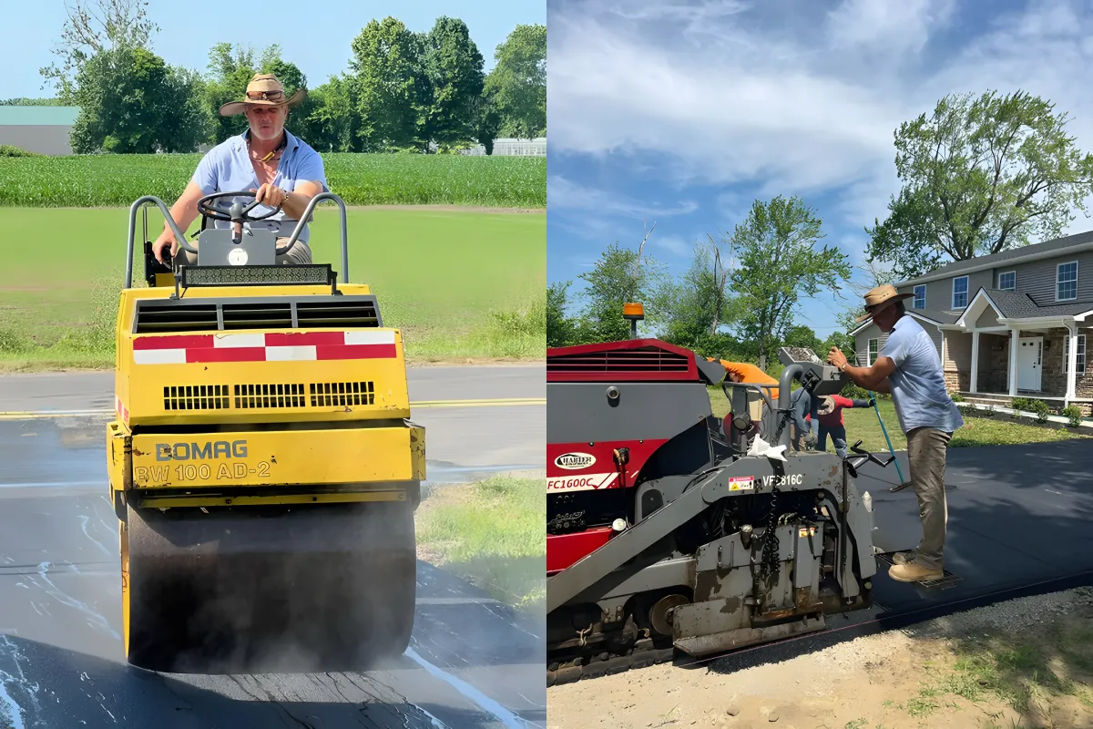 Professional asphalt paving: A worker operates a BOMAG BW 100 AD-2 road roller on a newly paved road, while another worker manages a paving machine near a residential driveway. The scene showcases high-quality asphalt installation and driveway paving services in action.
