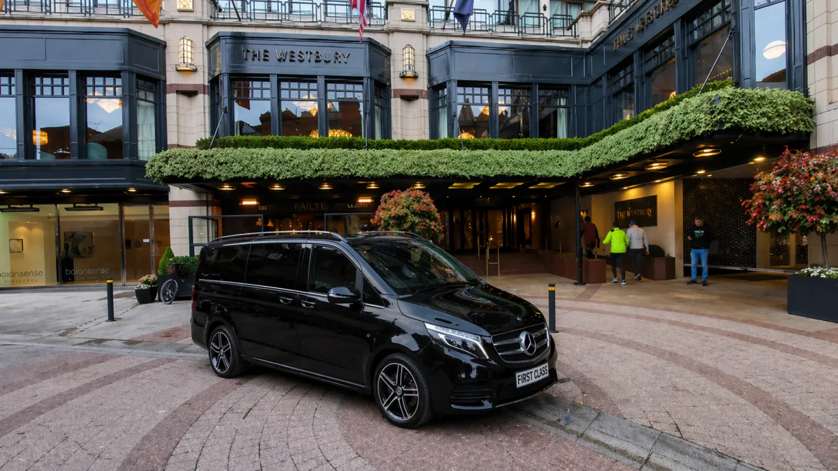chauffeur Black Mercedes V-Class arriving at the westbury hotel dublin