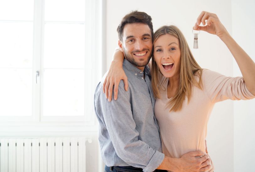 a modern house with a pool and lounge chairs