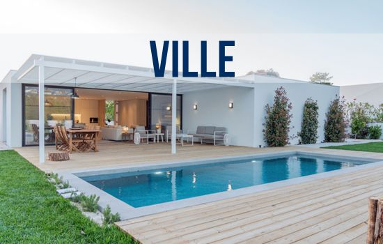 a modern house with a pool in front of it