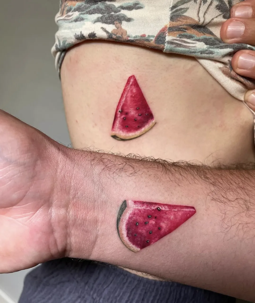 person with tattoo on right arm