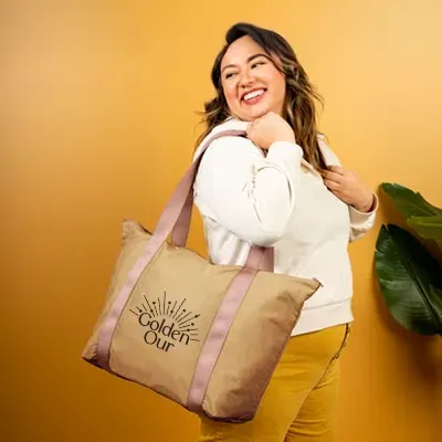 Smiling woman holding tote bag