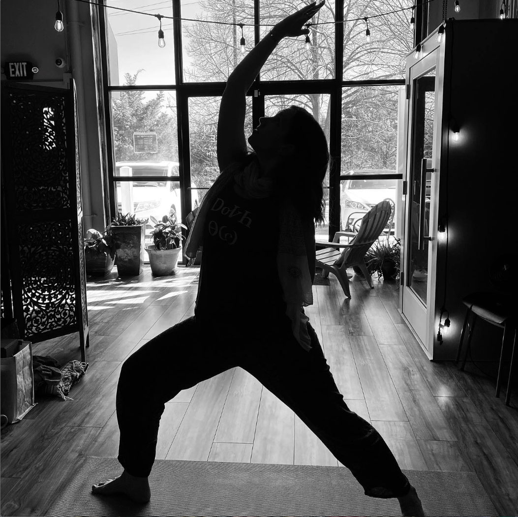 silhouette of member doing yoga