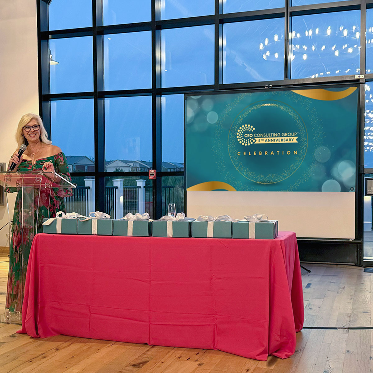 CEO woman with presents and presentation video