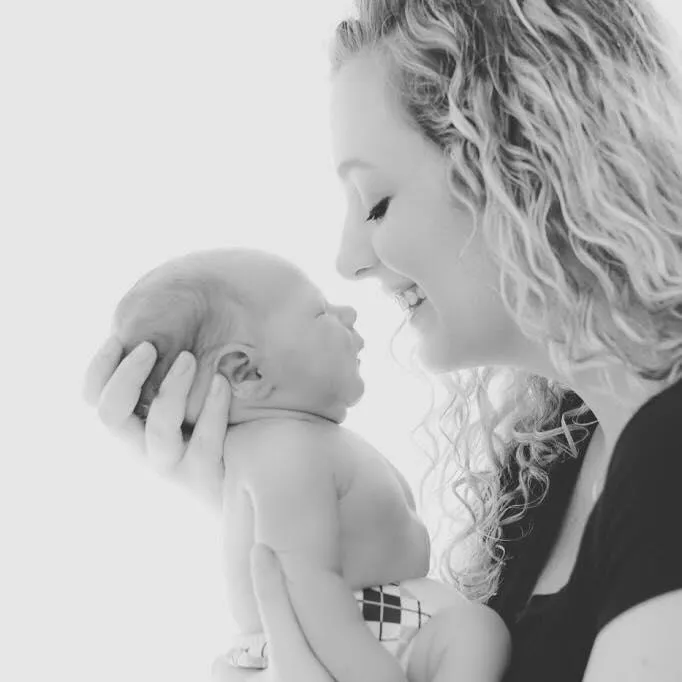 a person holding a baby