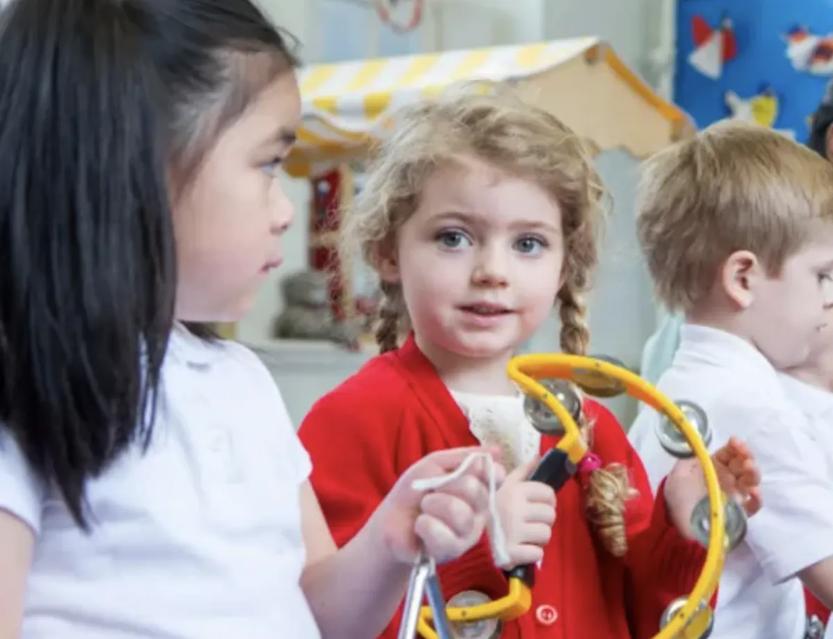 Girl follows directions during arts and crafts time.