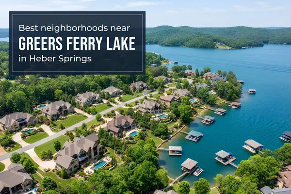 Aerial view of Greers Ferry Lake at sunset with homes and wooded hills