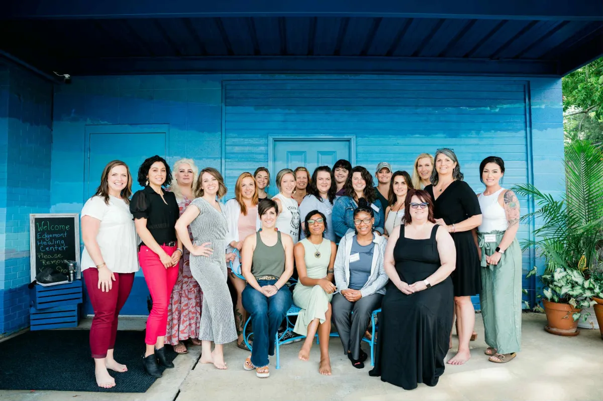 a person walking along a beach next to the ocean