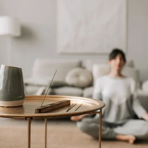 Image of Suzanne Smith, seated with cup of tea