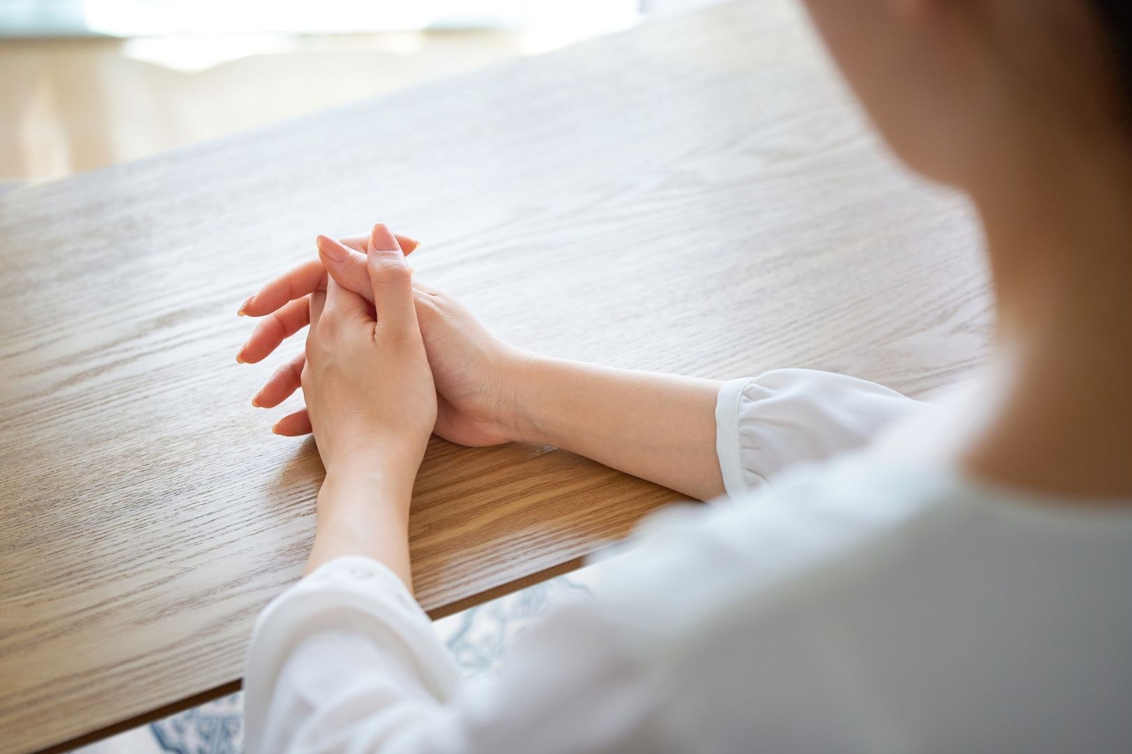 Calm supportive hands resting on a notebook