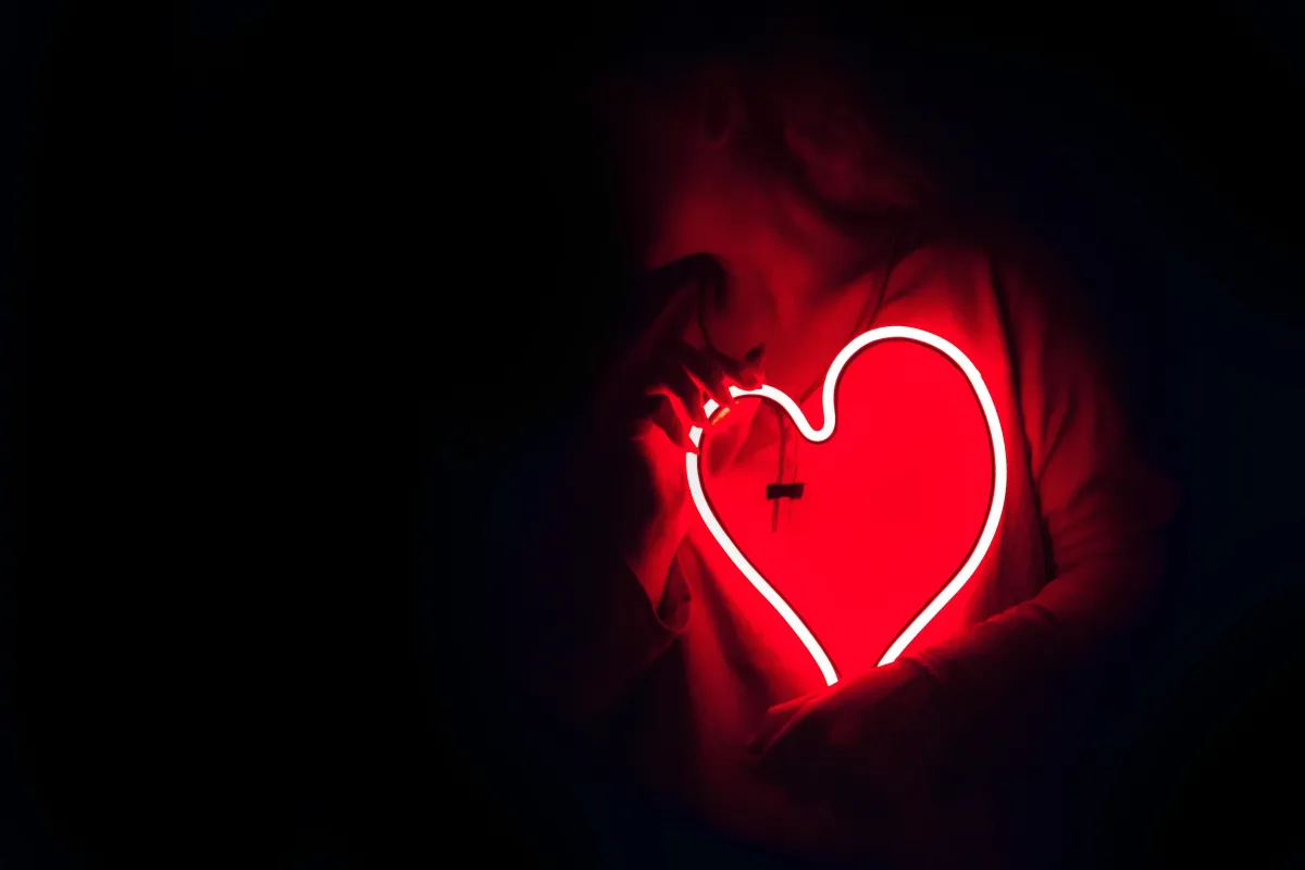 ENERGY PLAY a woman holding heart shaped led light