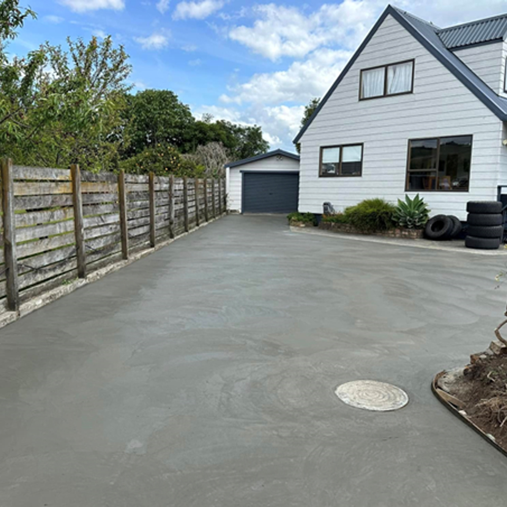 Concrete driveway installation with broom finish in Queenstown