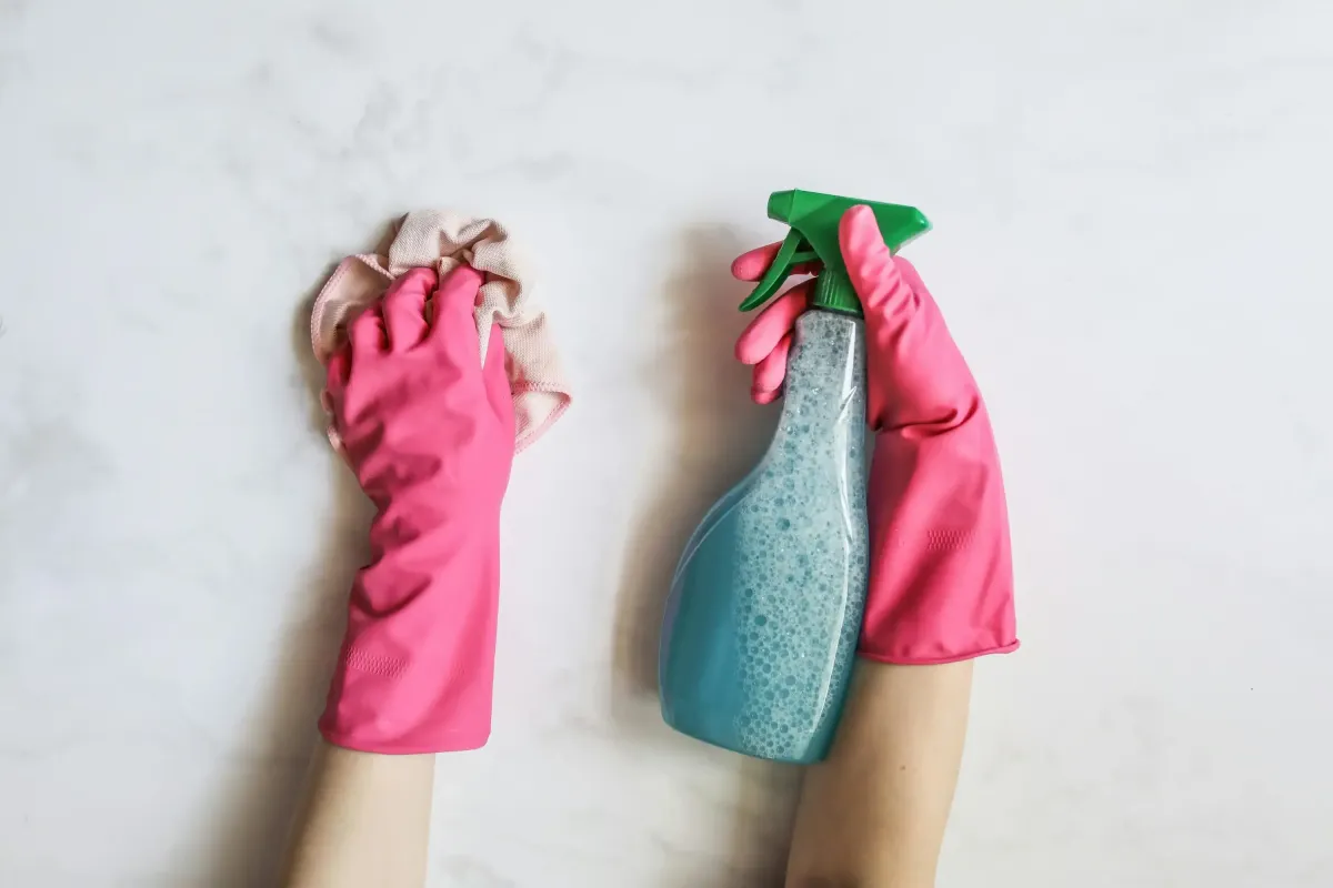 Professional commercial sanitization service disinfecting high-touch surfaces in an office environment
