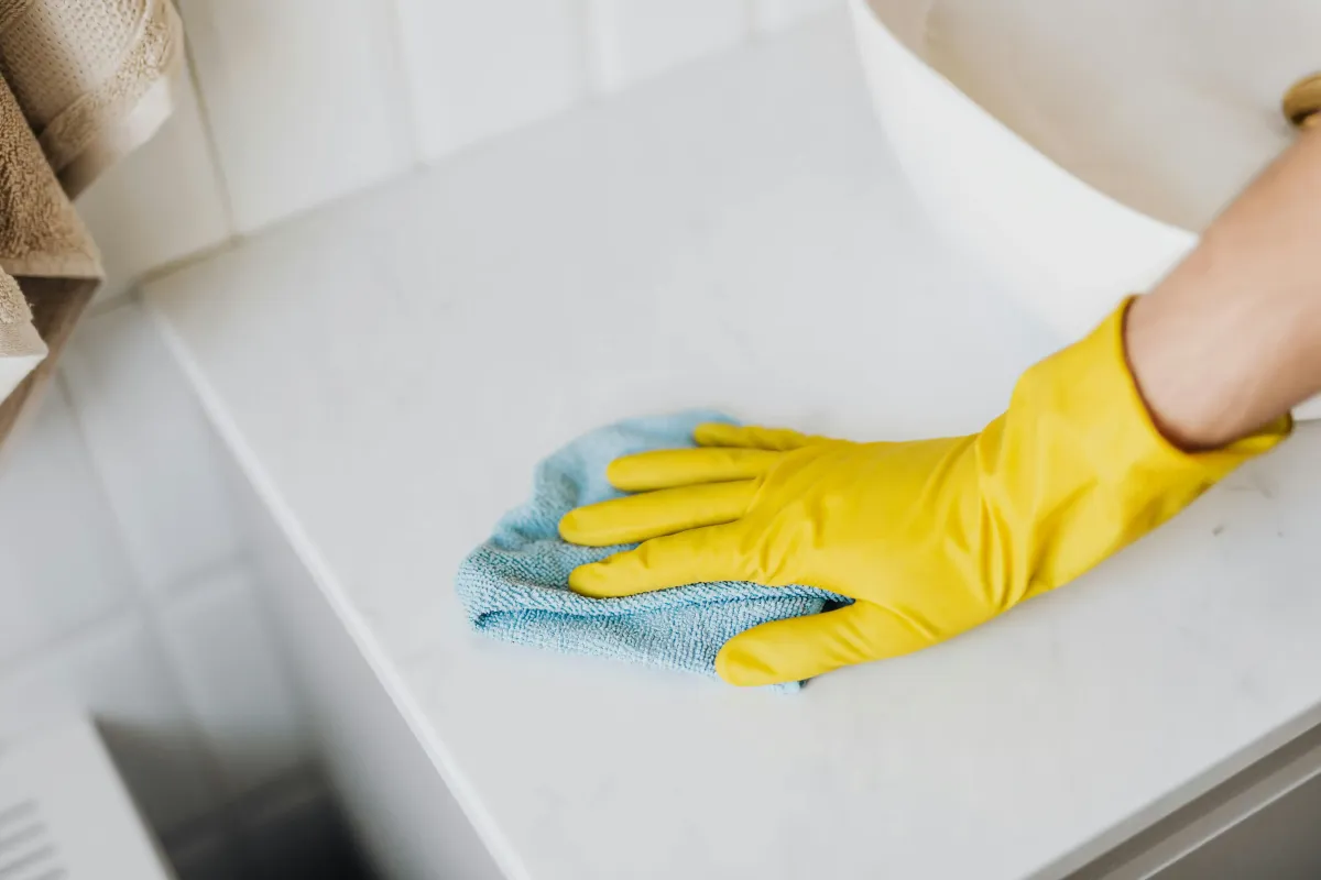 Professional commercial surface cleaning service disinfecting desks and high-touch office surfaces