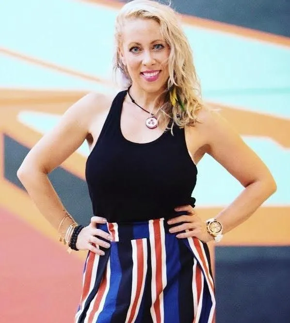 tree on body of water near mountains