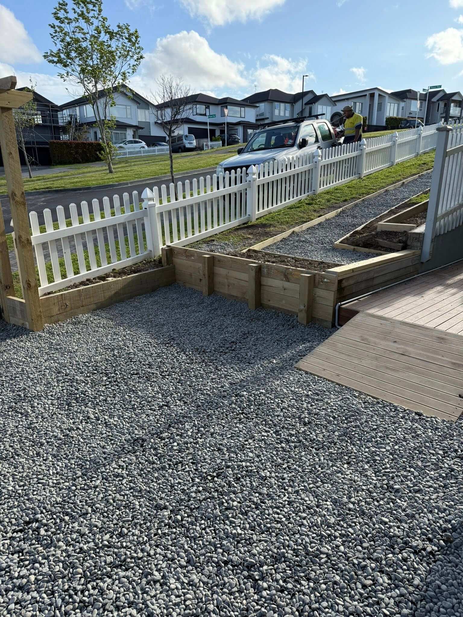 white picket fence and timber retaining wall installation Papatoetoe Auckland